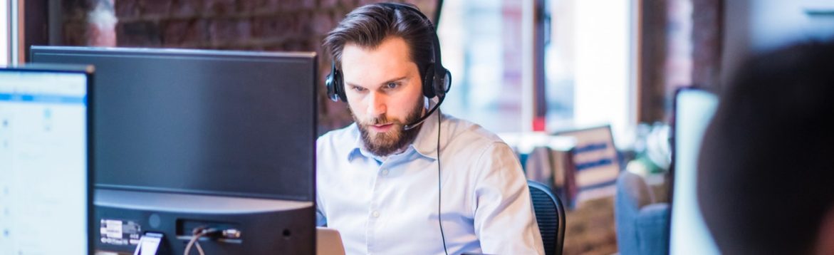 Photo Of Man In Official Shirt Sitting Looking At his Laptop